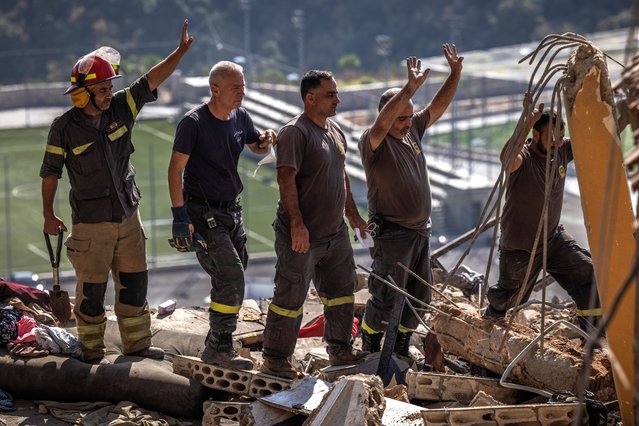 Emergency response workers look for bodies in the rubble of a building that was hit by a Israeli airstrike that killed more than 20 people according to Lebanese officials at the scene on November 6, 2024 in Barja, Lebanon. Israel has kept up its aerial attacks on what it alleges are Hezbollah sites across Lebanon. Israel also invaded Southern Lebanon in early October, marking a new phase in a conflict that spilled over from the Israel Hamas war. It marks Israel's fourth invasion of Lebanon since 1978. (Photo by Ed Ram/Getty Images)