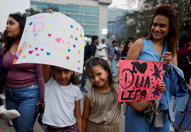 Girls hold posters outside the venue of the Dua Lipa concert in Mumbai, India on November 30, 2024. (Photo by Francis Mascarenhas/Reuters)