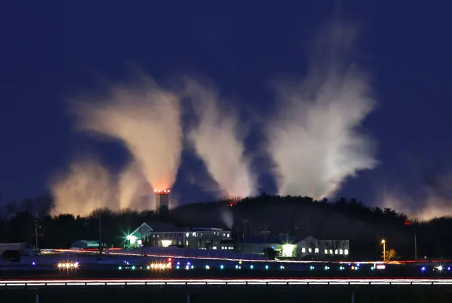 With the temperature at minus 6 degrees Fahrenheit, steam vapors from the Sappi paper mill dissipate into the early morning sky  in Westrbook, Maine, Thursday morning, January 24, 2013. (Photo by Robert F. Bukaty/AP Photo)