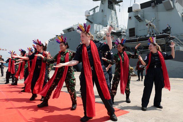 British Royal Navy and Indonesian Navy members perform a traditional dance during a welcoming ceremony for the Batch 2 River-class offshore patrol vessel HMS Spey at Tanjung Prior port in Jakarta, Indonesia, 15 January 2025. HMS Spey will visit Jakarta from 15 to 21 January to engage with the Indonesian navy in military cooperation and conduct cultural activities with Indonesian partners. (Photo by Adi Weda/EPA/EFE)