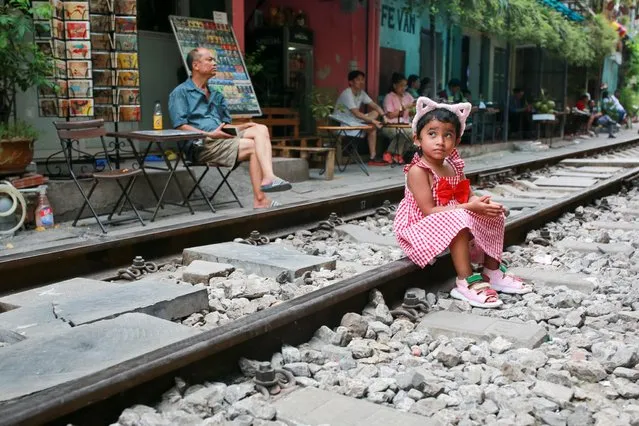 A view of popular train street in the old quarter of Hanoi, Vietnam on July 30, 2022. (Photo by Chris Humphrey/Anadolu Agency via AFP Photo)