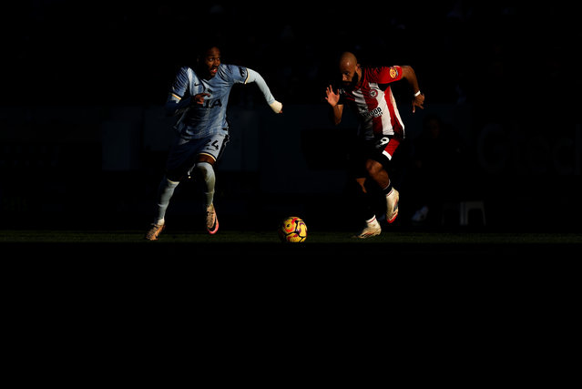 Djed Spence of Tottenham Hotspur runs with the ball whilst under pressure from Bryan Mbeumo of Brentford during the Premier League match between Brentford FC and Tottenham Hotspur FC at Brentford Community Stadium on February 02, 2025 in Brentford, England. (Photo by Richard Heathcote/Getty Images)