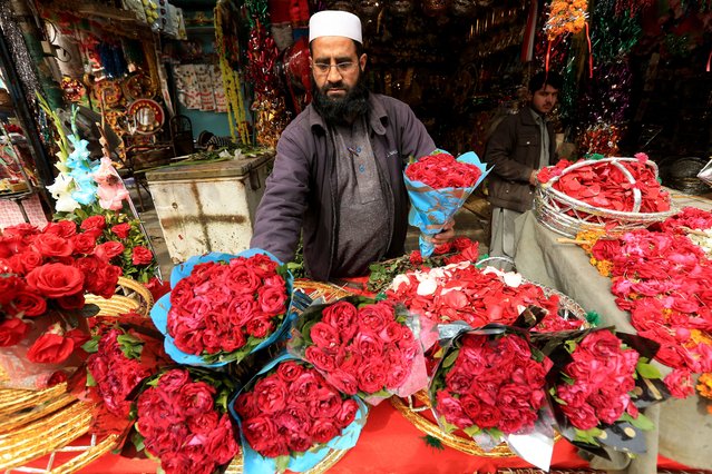 A vendor sells flowers during Valentine's Day in Peshawar, Pakistan, 14 February 2025. Valentine's Day, which traditionally is celebrated worldwide on 14 February, is considered to be un-Islamic in Pakistan. (Photo by Bilawal Arbab/EPA)