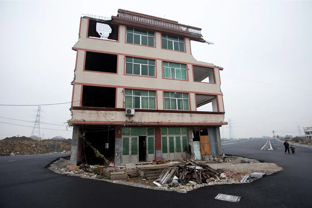 House in Middle of Chinese Highway