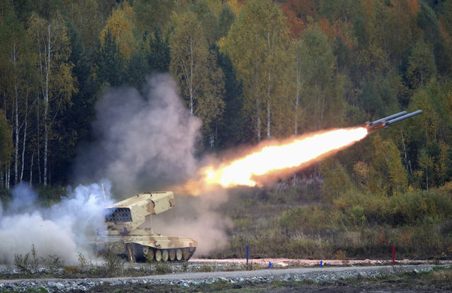 A Russian TOS-1 Buratino multiple rocket launcher fires during the Russia Arms Expo 2013 9th international exhibition of arms, military equipment and ammunition, in the Urals city of Nizhny Tagil, September 25, 2013. (Photo by Sergei Karpukhin/Reuters)