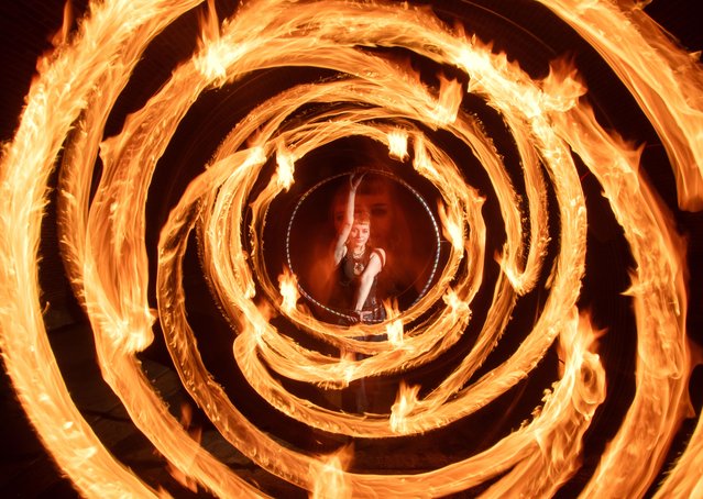 The M25 Fire Spinners practise their skills along the Thames path at Runnymede in Surrey, UK on February 22, 2025. (Photo by Kevin Jay/Picture Exclusive)