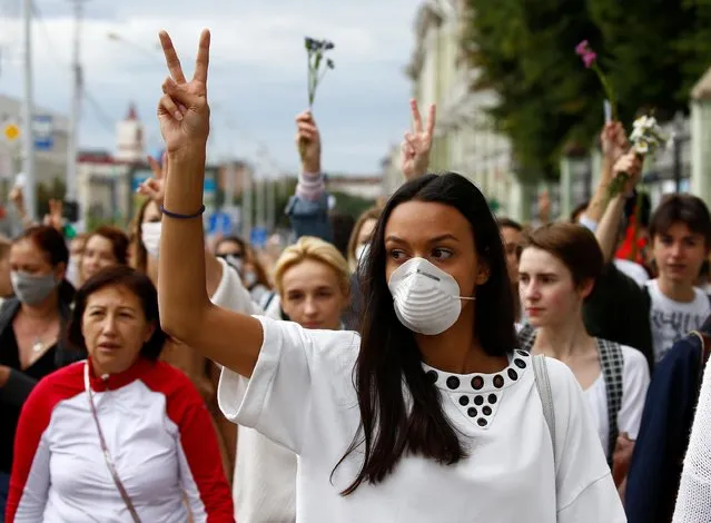 Women take part in a demonstration against police violence during the recent rallies of opposition supporters following the presidential election in Minsk, Belarus on August 12, 2020. (Photo by Vasily Fedosenko/Reuters)