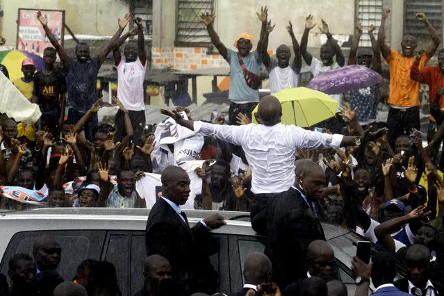 Ivory Coast's former youth minister Charles Ble Goude is cheered by supporters upon his return to Abidjan, Ivory Coast, Saturday November 26, 2022, after more than a decade in exile. Ble Goude was acquitted of charges linked to the violence that erupted after the disputed 2010 election when then President Laurent Gbagbo refused to concede. (Photo by Diomande Bleblonde/AP Photo)