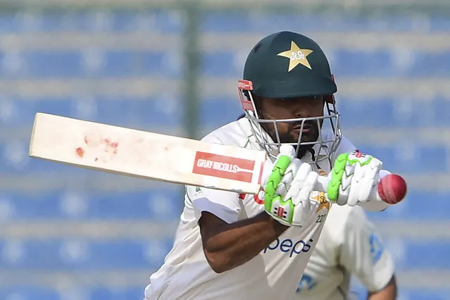 Pakistan's captain Babar Azam plays a shot during the first day of the first cricket Test match between Pakistan and New Zealand at the National Stadium in Karachi on December 26, 2022. (Photo by Asif Hassan/AFP Photo)