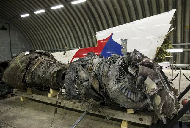 Wreckage of the MH17 airplane is seen after the presentation of the final report into the crash of July 2014 of Malaysia Airlines flight MH17 over Ukraine in Gilze Rijen, the Netherlands, October 13, 2015. (Photo by Michael Kooren/Reuters)