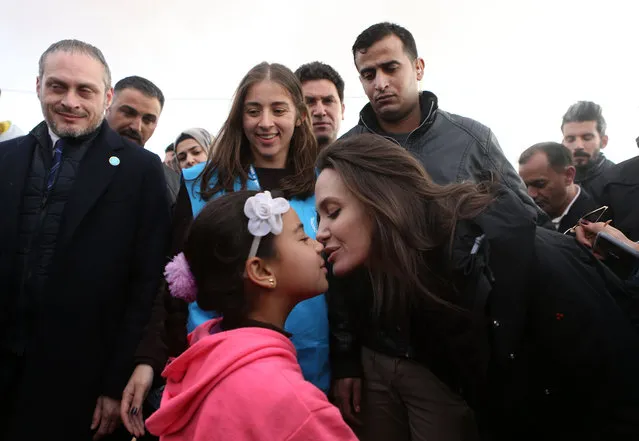 Special envoy of the U.N. refugee agency and movie star Angelina Jolie holds a press conference at the Zaatari camp for Syrian refugees on January 28, 2018 in Zaatari, Jordan. Jolie spoke in the camp, which is made up of hundreds of row of caravans, after meeting with Syrian refugees. The Hollywood star called for a political solution to Syria's civil war, saying that “humanitarian aid is not a long-term solution”. (Photo by Salah Malkawi/ Getty Images)