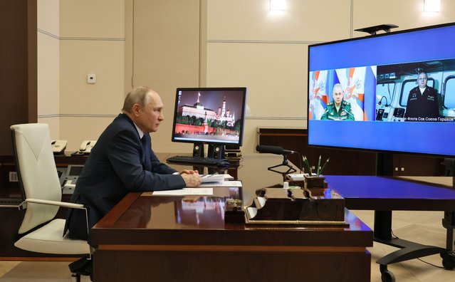 Russian President Vladimir Putin attends a videoconference with Russian Defense Minister Sergei Shoigu, left, on a tv screen, and Igor Krokhmal, commander of the frigate named “Admiral of the Fleet of the Soviet Union Gorshkov”, right on a tv screen, in Moscow, Russia, Wednesday, January 4, 2023. Putin on Wednesday sent a frigate off to the Atlantic Ocean armed with hypersonic Zircon cruise missiles. (Photo by Mikhail Klimentyev, Sputnik, Kremlin Pool Photo via AP Photo)