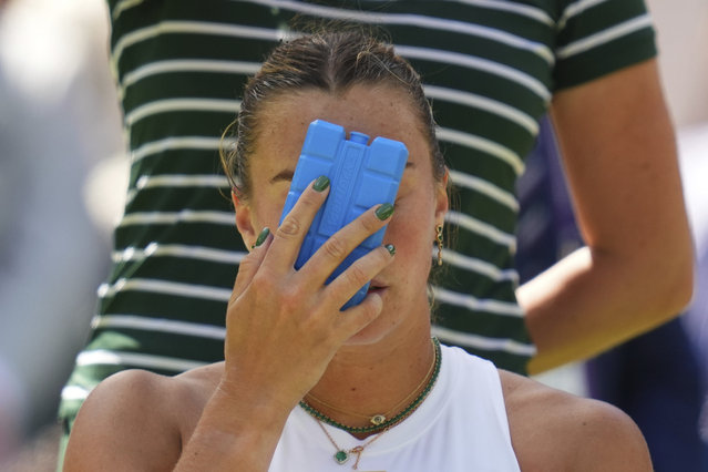 Aryana Sabalenka of Belarus tries to keep cool using an ice pack during a change of ends break as she plays Laura Siegemund of Germany during a quarterfinal women's singles match at the Wimbledon Tennis Championships in London, Tuesday, July 8, 2025. (Photo by Kirsty Wigglesworth/AP Photo)
