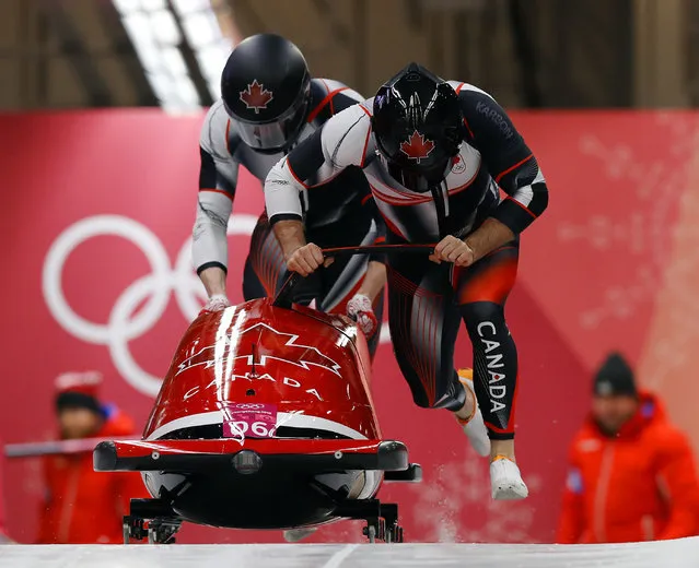 Driver Justin Kripps and Alexander Kopacz of Canada start their first run during the two-man bobsled competition at the 2018 Winter Olympics in Pyeongchang, South Korea, Sunday, Februaary 18, 2018. (Photo by Andy Wong/AP Photo)