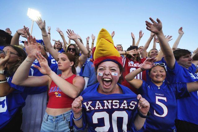 Fans cheer a Kansas touchdown during a college football game in Lawrence, Kansas, on Saturday, August 23, 2025. (Photo by Charlie Riedel/AP Photo)