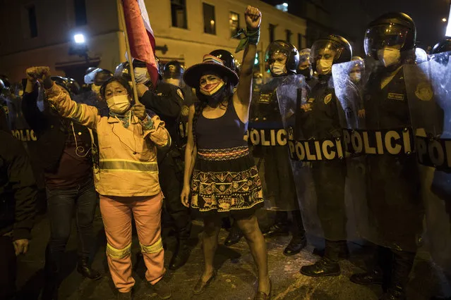 Pro-government protesters gather next to the Congress in Lima, Peru, Monday, November 9, 2020. (Photo by Rodrigo Abd/AP Photo)