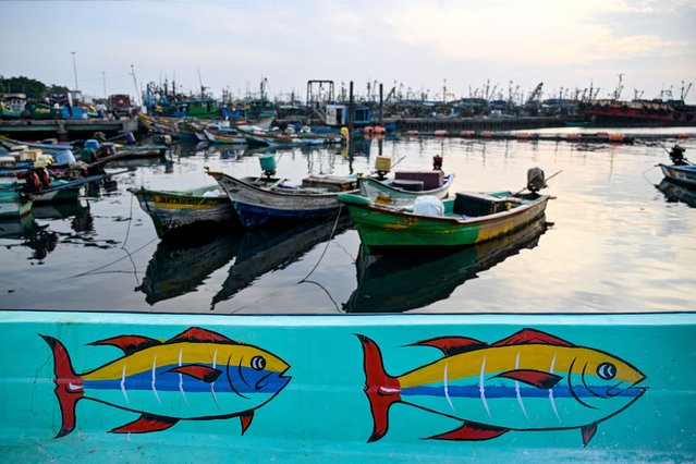 Fishing boats are moored at the Kasimedu fishing harbour in Chennai on August 25, 2025. US President Donald Trump has threatened to double import duties on India from 25 to 50 percent to punish New Delhi for buying oil from Russia, saying the purchases help Moscow fund its invasion of Ukraine.' Indian exporters are scrambling for options to mitigate the fallout as it threatens to upend low-margin, labour-intensive industries ranging from gems and jewellery to textiles and seafood. (Photo by R. Satish Babu/AFP Photo)
