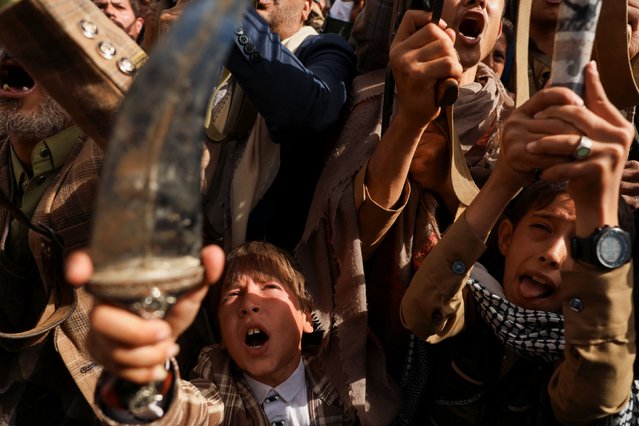 Children react as protesters, predominantly Houthi supporters, demonstrate in solidarity with Palestinians, in Sanaa, Yemen on July 18, 2025. (Photo by Khaled Abdullah/Reuters)