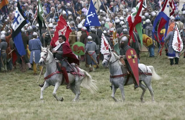 Re-enactors participate in a re-enactment of the Battle of Hastings, commemorating the 950th anniversary of the battle, in Battle, Britain October 15, 2016. (Photo by Neil Hall/Reuters)