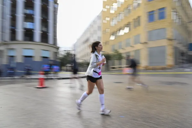 A runner takes part in the 9th edition of Women's Race 2023, a ten kilometer run in Beirut, Lebanon, 19 March 2023. (Photo by Wael Hamzeh/EPA)