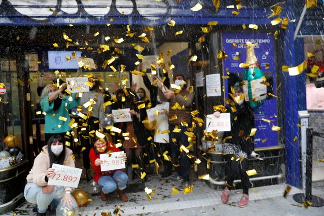 Lottery sellers of the store “Dona Manolita” celebrate winning numbers in Spain's Christmas lottery “El Gordo” (The Fat One), amid the coronavirus disease (COVID-19) outbreak, in Madrid, Spain on December 22, 2020. (Photo by Susana Vera/Reuters)