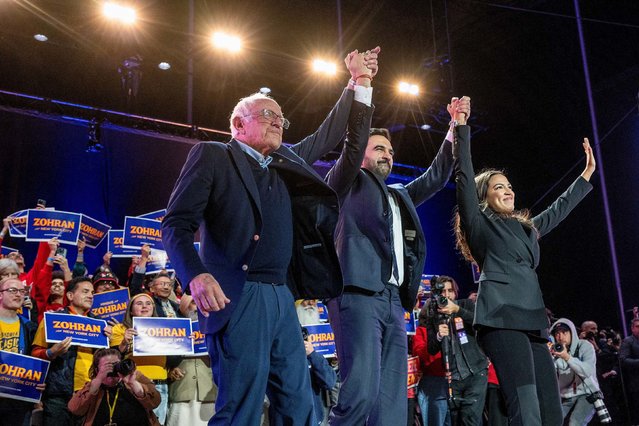 US Sen. Bernie Sanders, left, and US Rep. Alexandria Ocasio-Cortez attend a campaign event for New York City mayoral candidate Zohran Mamdani, center, on Sunday, October 26, 2025. (Photo by Victor J. Blue/Bloomberg/Getty Images)