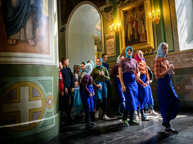 A group of school children visits a church in the Kremlin in the Russian city of Kazan on May 15, 2018. Kazan will host four group games, a Round of 16 match and a quarter-final of the 2018 FIFA World Cup. (Photo by Mladen Antonov/AFP Photo)