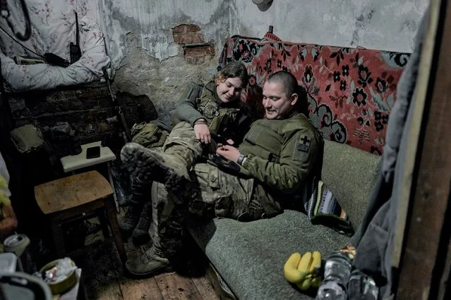 Ukrainian soldiers rest in a shelter at the frontline positions near Vuhledar, Donetsk region, Ukraine, Sunday, April 30, 2023. (Photo by Libkos/AP Photo)