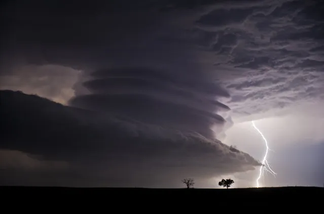 “Stacked Supercell with Lightning”. This huge mesocyclone supercell was near the Nebraska / Kansas border on the night of June 22nd, 2012. What a stunning structure! (Photo and caption by Jennifer Brindley/National Geographic Traveler Photo Contest)
