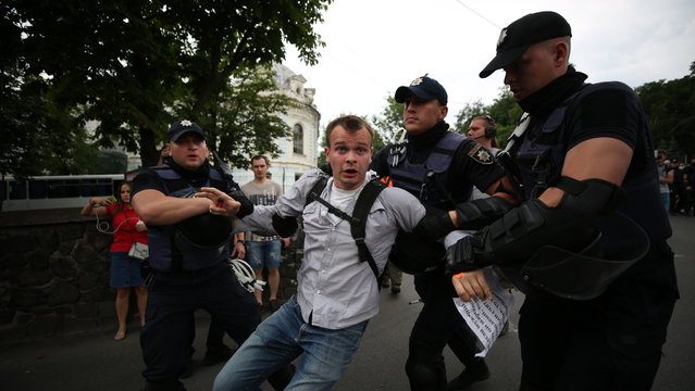Policemen detain an activist during a protest against a gay pride march in central Kiev, Ukraine on June 17, 2018. (Photo by Serhii Nuzhnenko/Radio Free Europe/Radio Liberty)