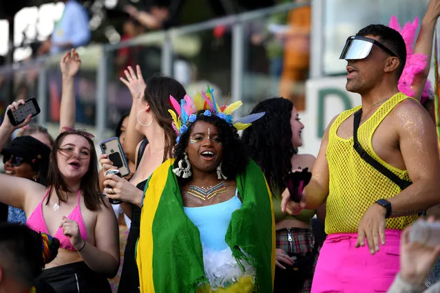 Spectators are seen in the crowd during the 43rd annual Gay and Lesbian Mardi Gras parade at the SCG in Sydney, Saturday, March 6, 2021. (Photo by Dan Himbrechts/AAP Image)