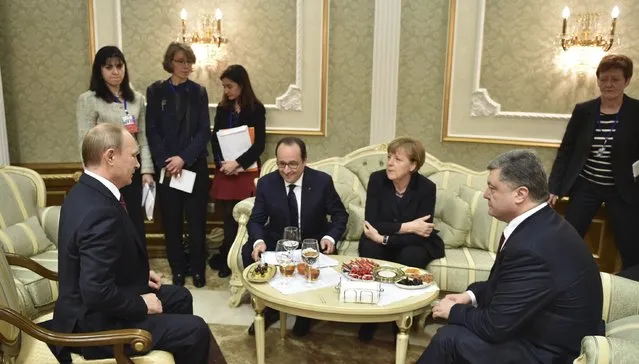 Russia's President Vladimir Putin (L), Ukraine's President Petro Poroshenko (R), Germany's Chancellor Angela Merkel (2nd R) and France's President Francois Hollande attend a meeting on resolving the Ukrainian crisis in Minsk, February 11, 2015. (Photo by Mykola Lazarenko/Reuters)