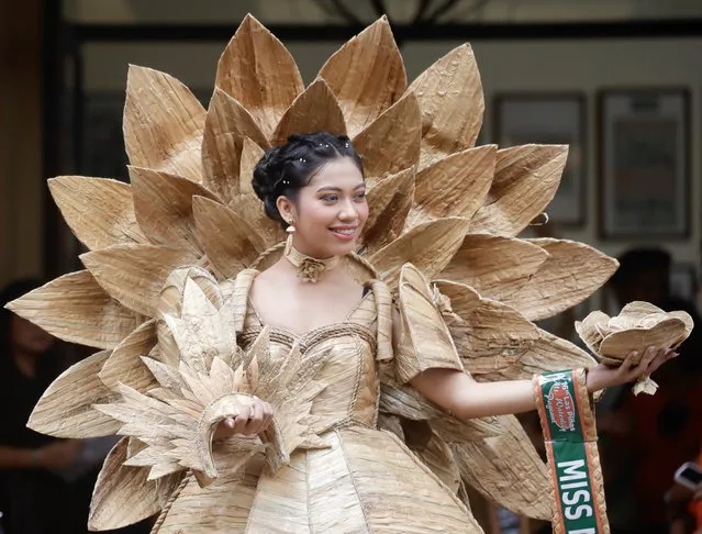 A Filipino woman wearing a gown made from dried water hyacinth stalks, poses during the Water Lily Festival in Las Pinas city, Metro Manila, Philippines on July 21, 2023. The Water Lily festival aims to promote the water hyacinth-based livelihood enterprises for residents in flood prone communities of Las Pinas city and adjacent cities. (Photo by Francis R. Malasig/EPA)