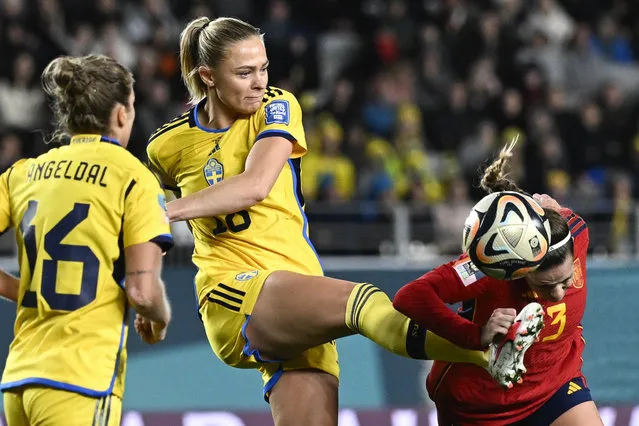 Sweden's Fridolina Rolfo attempts to kick the ball clear of Spain's Teresa Abelleira, right, during the Women's World Cup semifinal soccer match between Sweden and Spain at Eden Park in Auckland, New Zealand, Tuesday, August 15, 2023. (Photo by Andrew Cornaga/AP Photo)