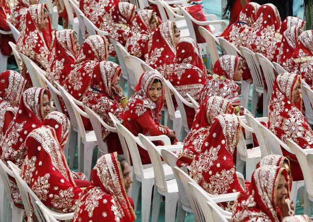 Muslim brides wait for the start of their mass marriage ceremony in the western Indian city of Ahmedabad, February 15, 2015. (Photo by Amit Dave/Reuters)