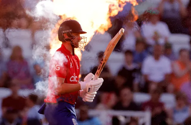 England's Will Jacks walks out as fire sprays behind him before the start of the T20 International cricket match between England and New Zeland in Nottingham, Britain on September 5, 2023. (Photo by Andrew Couldridge/Action Images via Reuters)