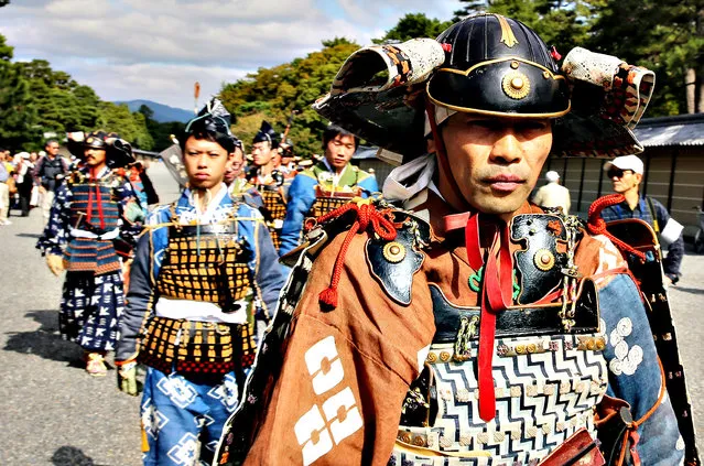People dressed in authentic costumes representing various periods and characters in Japanese feudal history participate in the annual Jidai Festival at Kyoto Imperial Palace on October 22, 2013 in Kyoto, Japan.  Each year approximately 2000 people participate in the Jidai Matsuri festival on October 22, the anniversary of the foundation of Kyoto. Participants dress in authentic costumes from almost every period of Japanese history and parade from the Imperial Palace to Heian Shrine.  (Photo by Buddhika Weerasinghe/Getty Images)