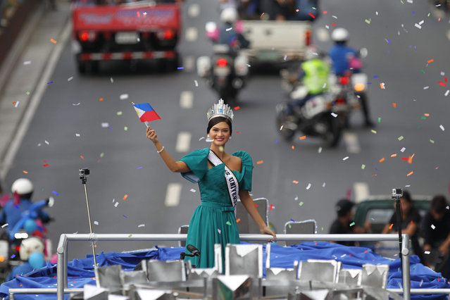 Miss Universe 2015 Pia Alonzo Wurtzbach (C) of the Philippines waves to the crowd during her homecoming parade in Manila, Philippines, 25 January 2016. Miss Universe 2015 Pia Wurtzbach returned home to the Philippines Saturday for a weeklong visit, the first since she won the crown in December. She will attend a charity event and meet with President Benigno Aquino and other government officials during her trip. Wurtzbach is the third Filipino to win Miss Universe after Gloria Diaz in 1969 and Margie Moran in 1973. (Photo by Mark R. Cristino/EPA)