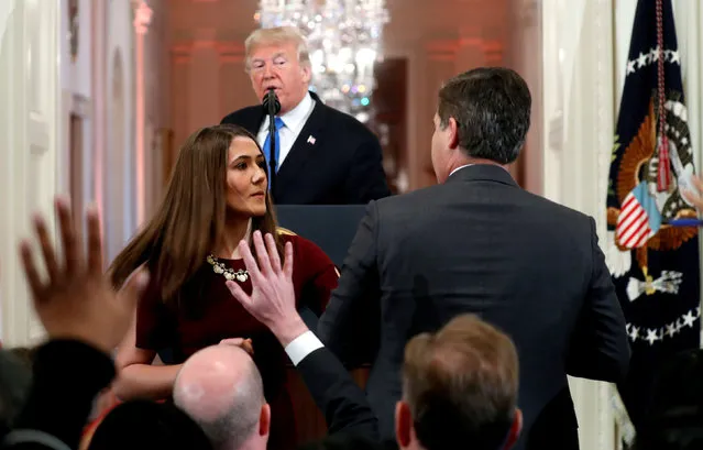 A White House staff member steps in to try to take the microphone away from CNN's Jim Acosta as he questions U.S. President Donald Trump during a news conference following Tuesday's midterm U.S. congressional elections at the White House in Washington, U.S., November 7, 2018. (Photo by Kevin Lamarque/Reuters)