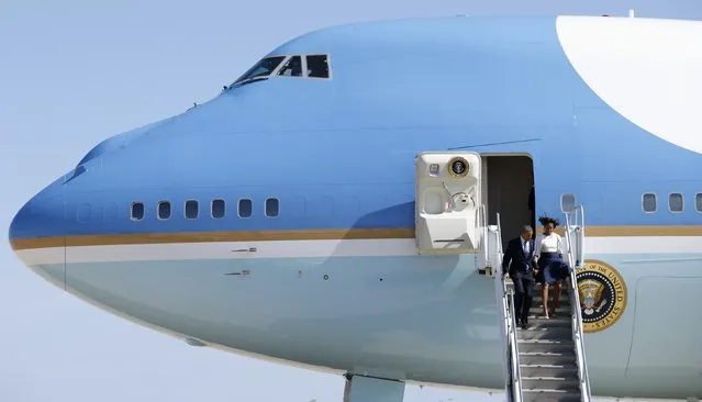 U.S. first lady Michelle Obama and President Barack Obama step from Air Force One upon their arrival in Austin, Texas, in this file photo taken April 10, 2014. Boeing Co has won a contract to start preliminary design work on a new fleet of Air Force One presidential aircraft based on its 747-8 commercial airliner, the Pentagon said on Friday. (Photo by Kevin Lamarque/Reuters)