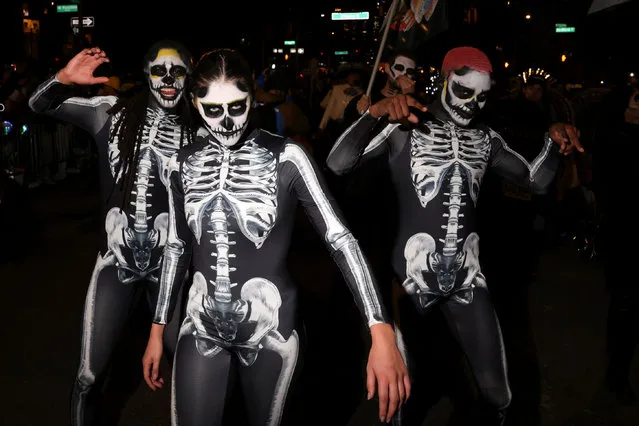 People attend the 50th annual NYC Halloween Parade in New York City on October 31, 2023. (Photo by Caitlin Ochs/Reuters)