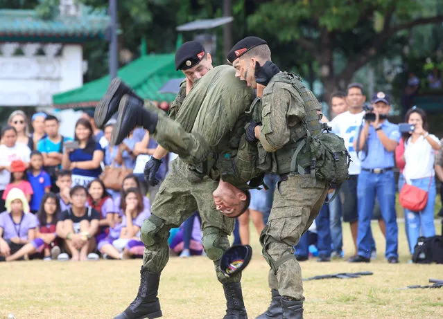 Russian Marines, who are stationed onboard the anti-submarine vessel Admiral Tributs, show their individual combat skills during a public demonstration of capabilities at Luneta National Park in Metro Manila, Philippines January 5, 2017. (Photo by Romeo Ranoco/Reuters)