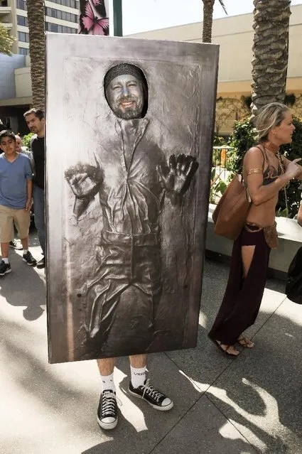 A Star Wars Fan waits in line to enter the Star Wars Celebration: The Ultimate Fan Experience held at the Anaheim Convention Center on Thursday, April 16, 2015, in Anaheim, Calif. (Photo by Richard Shotwell/Invision/AP Photo)