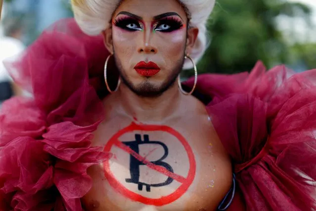 A person participates in a protest against the use of Bitcoin as legal tender, in San Salvador, El Salvador, September 7, 2021. (Photo by Jose Cabezas/Reuters)