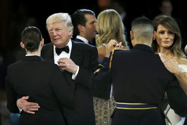 United States Navy Petty Officer Second Class Catherine Cartmell dances with President Donald Trump as United States Army Staff Sergeant Jose A. Medina dances with First Lady Melania Trump during the Salute to Our Armed Services Ball on Inauguration Day in Washington,  January 20, 2017. (Photo by Rick Wilking/Reuters)