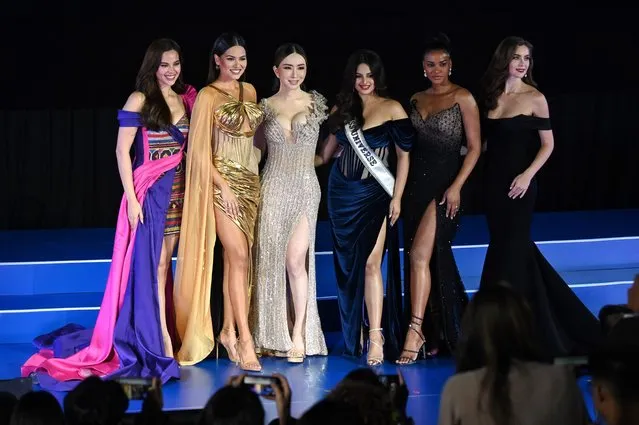 (L-R) Miss Universe 2018 Catriona Gray, Miss Universe 2020 Andrea Meza, CEO of JKN Global Group Jakapong “Anne” Jakrajutatip, Miss Universe 2021 Harnaaz Sandhu, Miss Universe 2011 Leila Lopes and Miss Universe 2005 Natalie Glebova stand on stage together during the Miss Universe Extravaganza, after JKN's acquisition of the Miss Universe franchise, in Bangkok on November 7, 2022. (Photo by Lillian Suwanrumpha/AFP Photo)