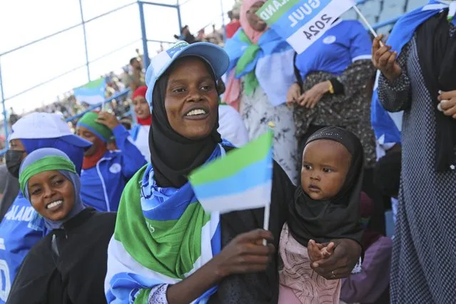 Fans watch the soccer league match between Hirshabele and Jubaland at a stadium in Mogadishu, Somalia, Tuesday, January 23, 2024. A stadium in the violence-prone Somali capital is hosting its first soccer tournament in three decades, drawing thousands of people to a sports facility that had fallen into disuse and later became a military base amid civil war. (Photo by Farah Abdi Warsameh/AP Photo)