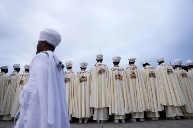 Ethiopian Orthodox Church Deacons attend the prayer session next to the holy water, during the annual Epiphany celebration called “Timket” to commemorate Jesus Christ's baptism in the Jordan River by John the Baptist, in Addis Ababa, Ethiopia, on January 20, 2024. (Photo by Tiksa Negeri/Reuters)