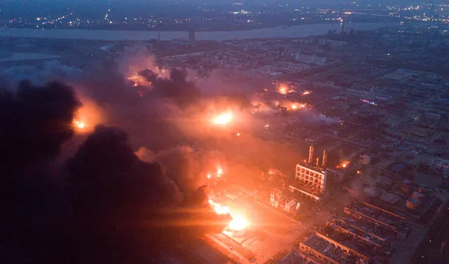 Smoke billows from fire following an explosion at the pesticide plant owned by Tianjiayi Chemical, in Xiangshui county, Yancheng, Jiangsu province, China March 21, 2019. (Photo by Reuters/China Stringer Network)
