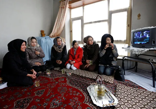 Students of the Shaolin Wushu club watch television at a friend's house in Kabul, Afghanistan February 2, 2017. (Photo by Mohammad Ismail/Reuters)